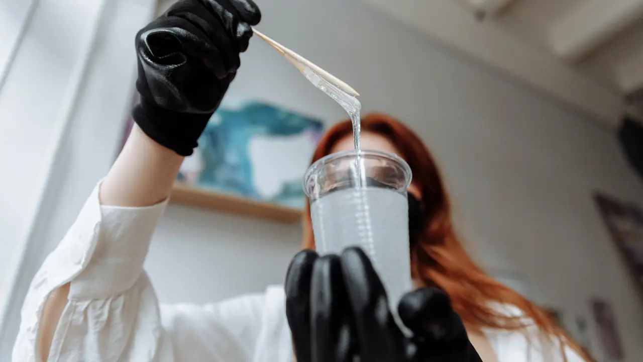 the-creator-uses-epoxy-resin-and-hardener-and-checks-the-condition