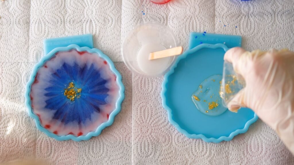 Handmade resin coasters with blue purple flower design and gold leaf accents