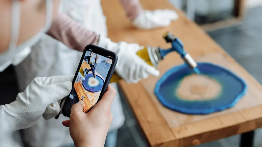 Torching an epoxy resin geode coaster to remove air bubbles while photographing the process