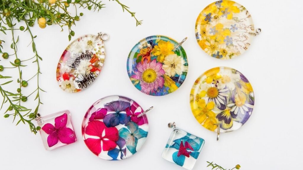 Collection of pressed flower resin pendants and jewelry in assorted shapes